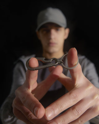 model-holding-urh-brand-keyring-in-hand-photo