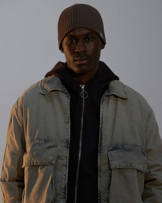 model-wearing-urh-brand-brown-color-rib-pattern-knit-beanie-photo
