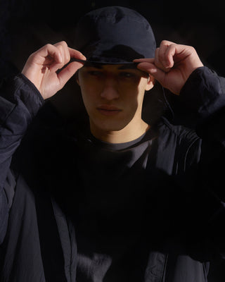 model-wearing-urh-brand-flexible-brim-black-bucket-hat-photo