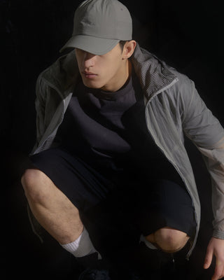 model-wearing-urh-brand-gray-color-nylon-ball-cap-photo