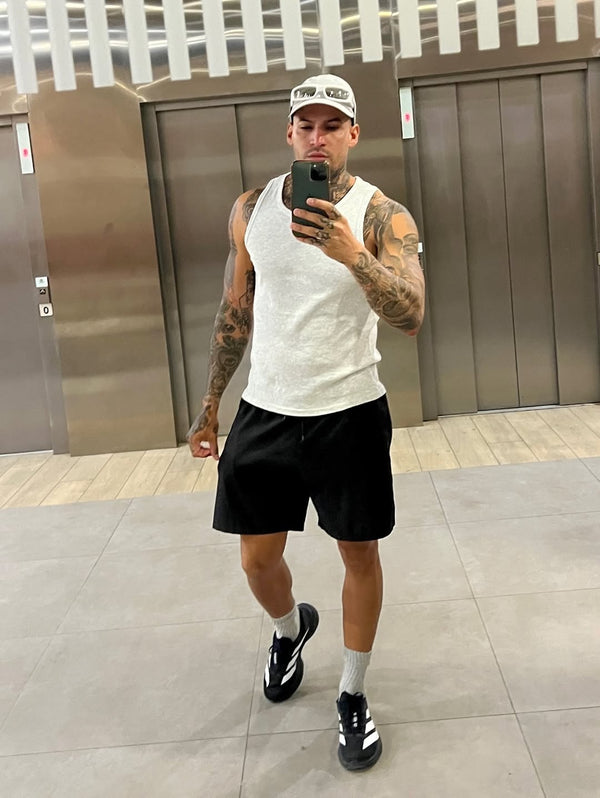 @joellirica wearing URH OPT Washed Cap