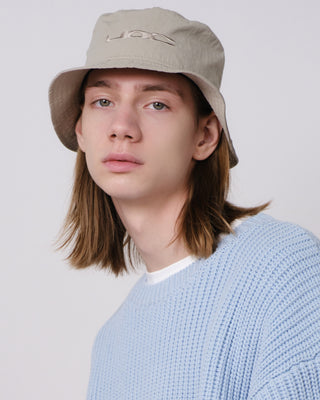 Sun-protective bucket hat with a breathable design