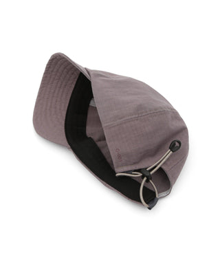 Foldable ball cap being packed in a bag