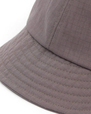 Short visor ball cap on a sunny day