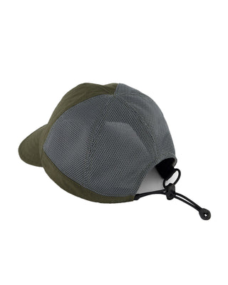 Foldable ball cap displayed on a backpack