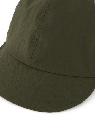 Foldable cap fitting into a travel bag