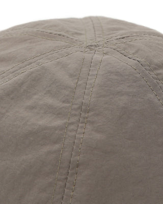 Baseball cap with short visor on a picnic