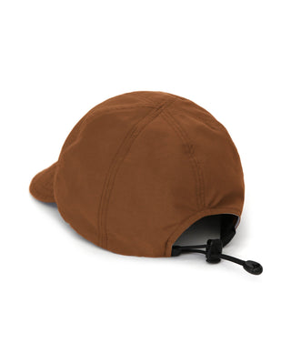 Baseball cap with short visor on a picnic