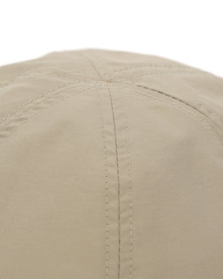 Baseball cap with short visor in outdoor setting