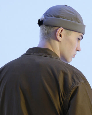 Watch cap in a cityscape setting