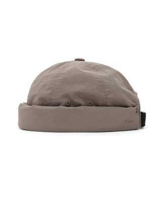 Adjustable brimless cap on a mountain peak