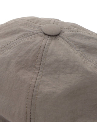 Group of friends wearing brimless caps on a camping trip