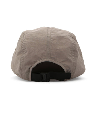 Close-up of a camp cap highlighting its fabric and details.
