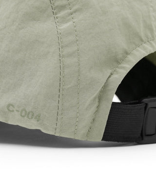 Collection of camp caps in various colors and designs.
