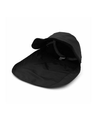 A person wearing a sun hat while enjoying a sunny outdoor activity.