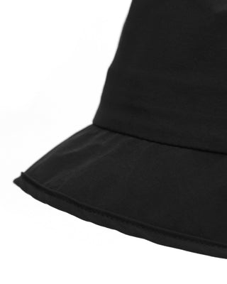 Safari hat paired with adventure gear, ready for exploration.