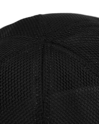 Group of friends wearing brimless caps on a camping trip