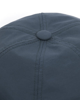 Group of friends wearing brimless caps on a camping trip