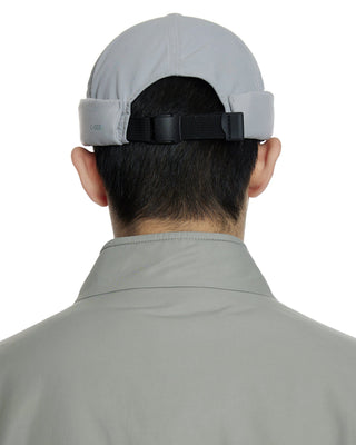 Watch cap in a cityscape setting