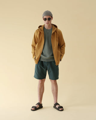 Brimless cap with an embroidered logo