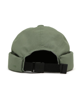 Watch cap in a cityscape setting