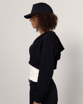 Trucker cap with an adjustable snapback.