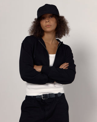 Curved visor cap emphasizing a sporty look.