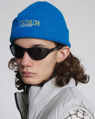 - Model wearing a short beanie in winter