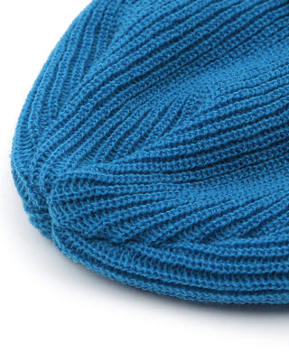 - Short beanie in a cozy indoor setting