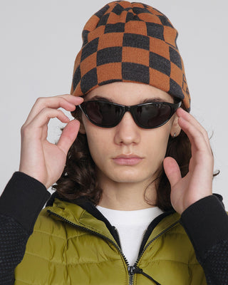 - Model wearing a classic beanie