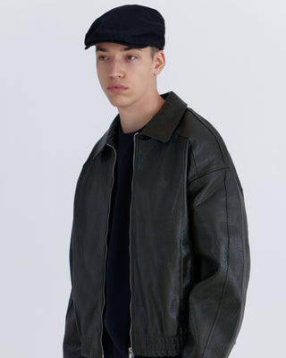 Model wearing hunting cap reversed