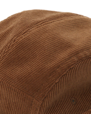 A group of friends wearing adjustable skull caps during a picnic.