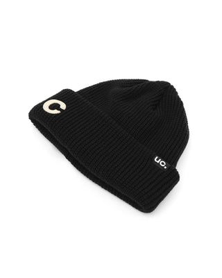 Model wearing a short beanie in winter