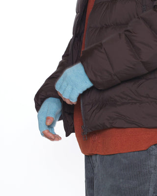 Fingerless gloves worn during a winter hike