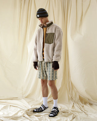 Fingerless gloves paired with a winter outfit