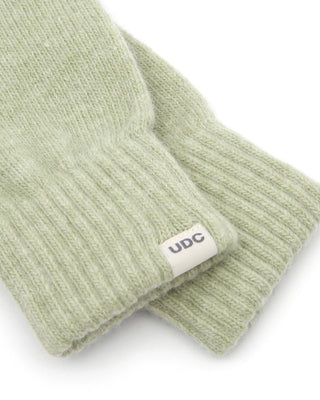 Close-up of cozy winter gloves in a snowy setting