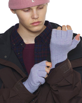 Close-up of cozy winter gloves in a snowy setting