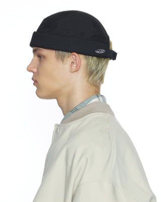 Watch cap in a snowy landscape