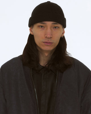 Elegant brimless cap for formal occasions.