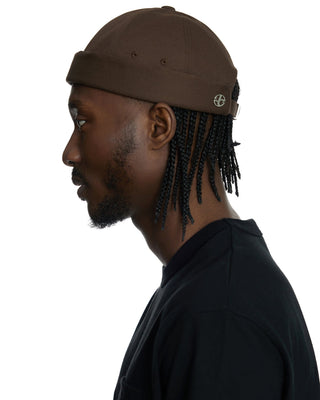 Classic brimless cap design.