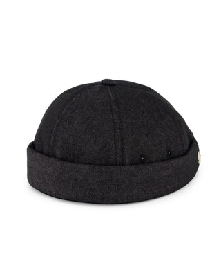 Elegant brimless cap for formal occasions.