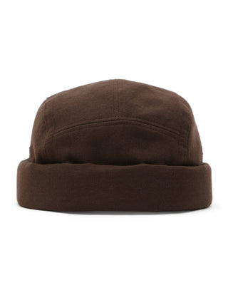 Faded black skull cap flat lay image