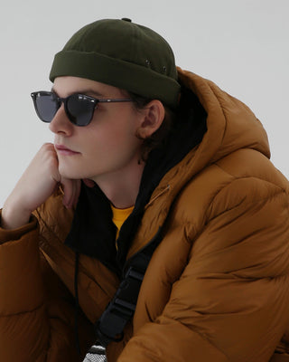 Adjustable brimless cap on a mountain peak