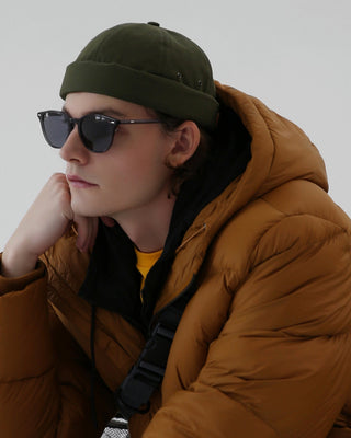 Adjustable brimless cap on a mountain peak