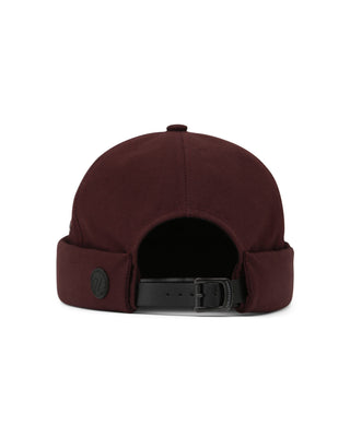 Watch cap in a cityscape setting