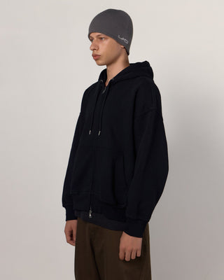 Collection of colorful beanies on display