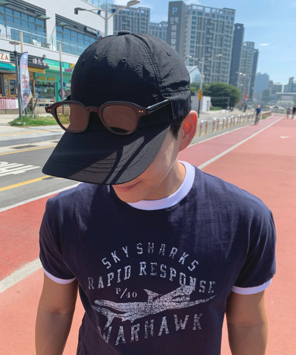@slozk wearing URH OPT Washed Cap