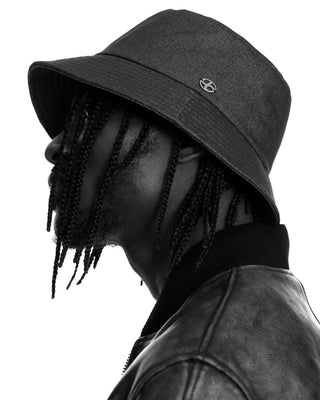 model-wearing-undercontrol-overfit-bucket-hat-black-and-white-photo