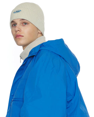 model-wearing-undercontrol-brand-milk-color-beanie-photo