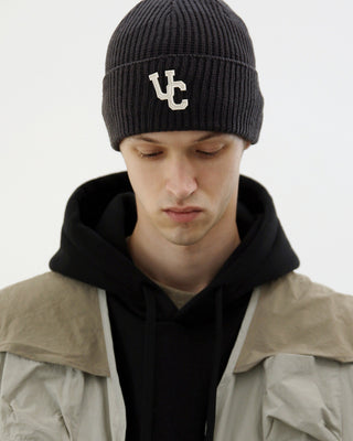 model-wearing-undercontrol-brand-charcoal-color-beanie-with-signature-logo-photo